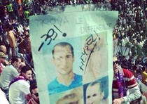 Fiorentina fans show a banner gloating about the Heysel disaster